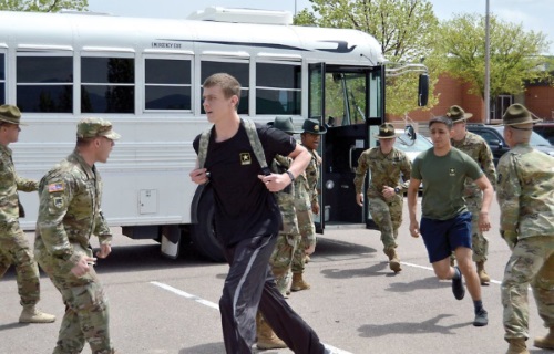 army recruits getting off bus and yelled at by drill instructors