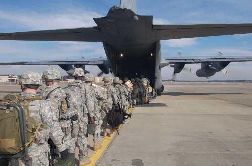 army airborne students walking into a c 130