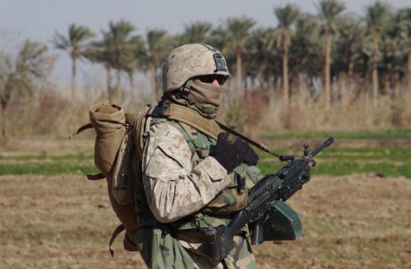 0331 carrying a Squad Automatic Weapon, or SAW