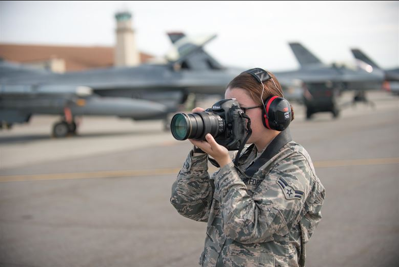 an Photojournalist (3N0X5) at work