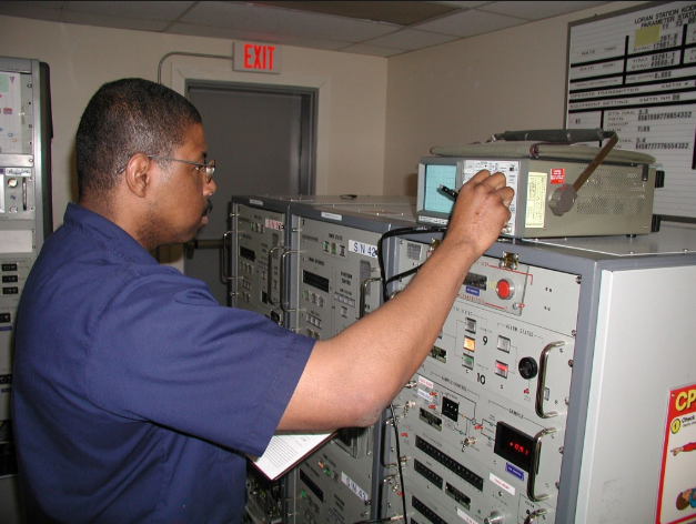 an Electronics Technician at work