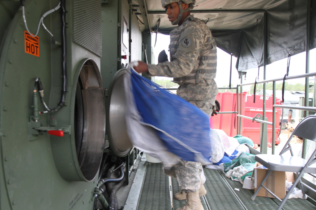 an Shower, Laundry Clothing Repair Specialist at work