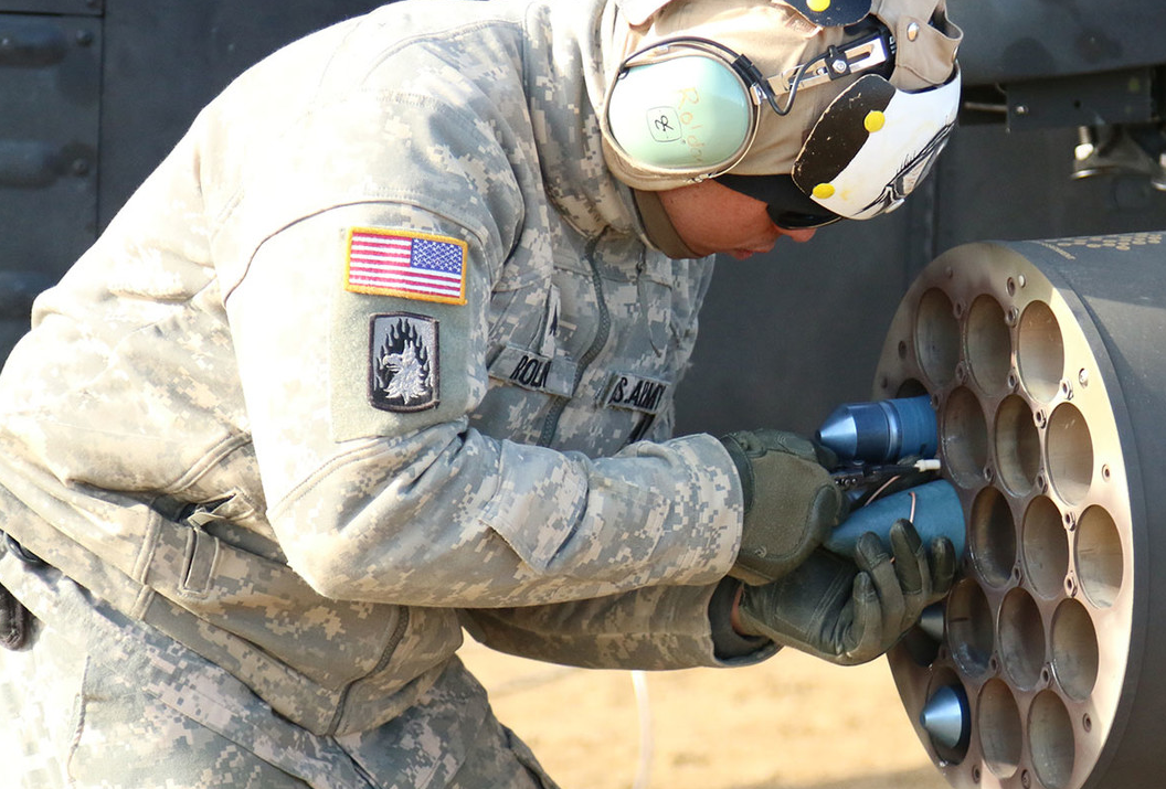 an AH-64D Armament / Electrical /Avionics Repairer at work