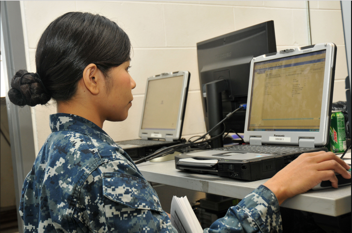 an Aviation Maintenance Administration Man at work