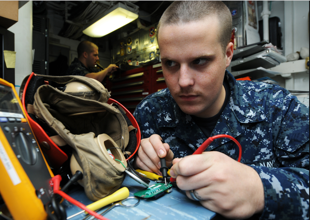 an Electronics Technician at work