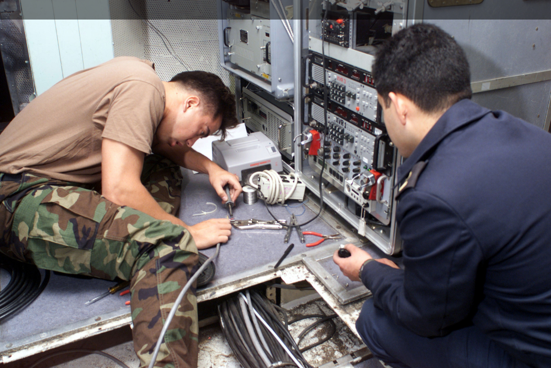 an Electronics Technician at work