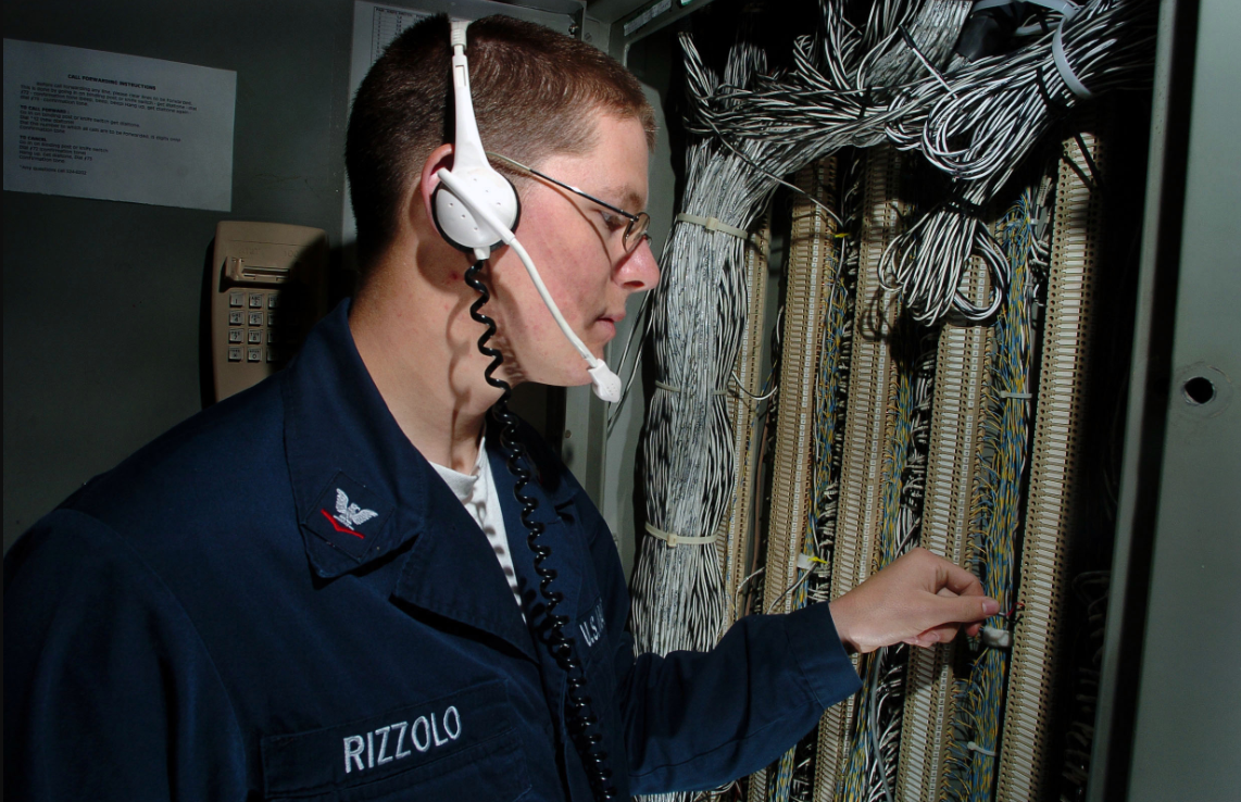 an Interior Communications Electrician at work