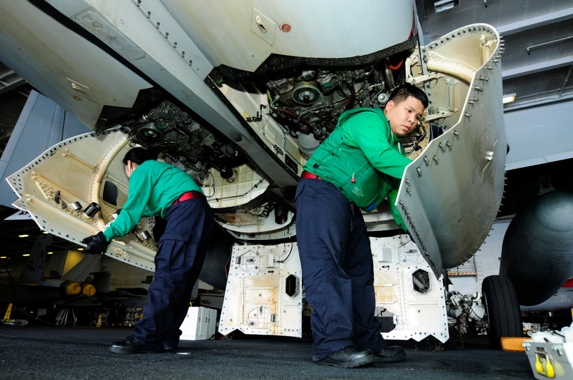 an Aviation Machinist's Mate at work