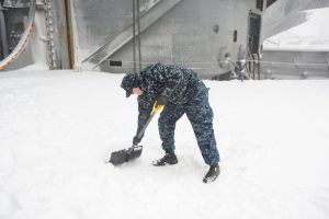 navy et shoveling snow