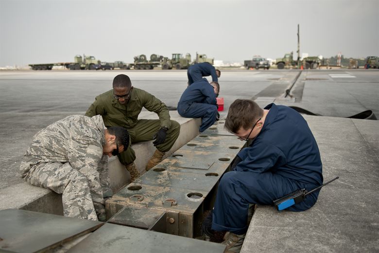 An Expeditionary Airfield Systems Technician at work