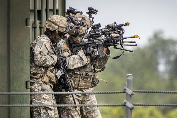 Army Rangers prepare to enter a building during a demonstration