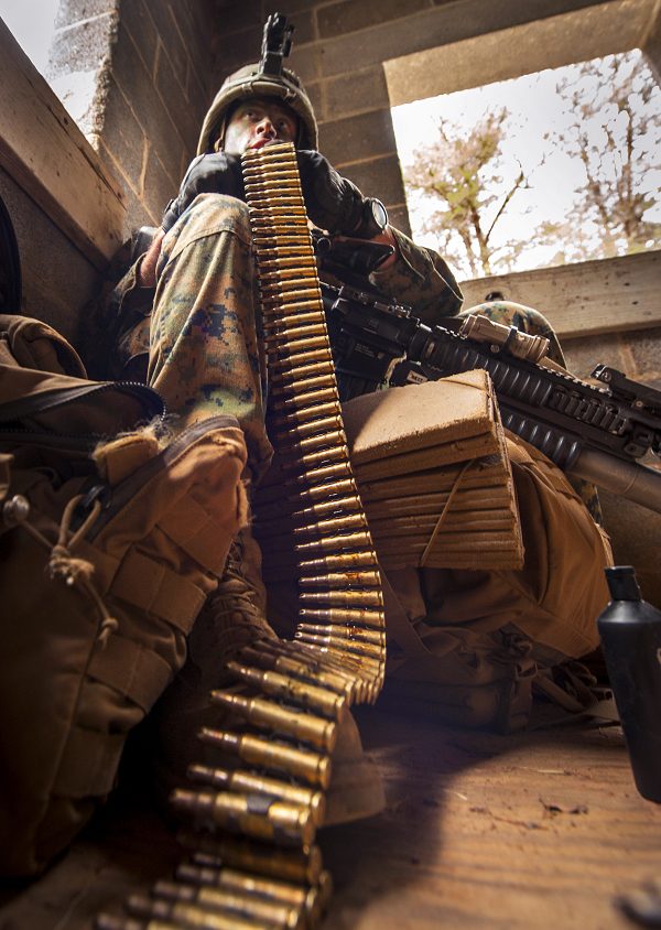 Marine Corps officer prepares his ammunition during The War field training exercise