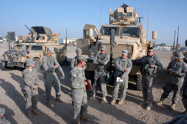 National Guard conduct a briefing at Camp Liberty, Iraq, before a mission