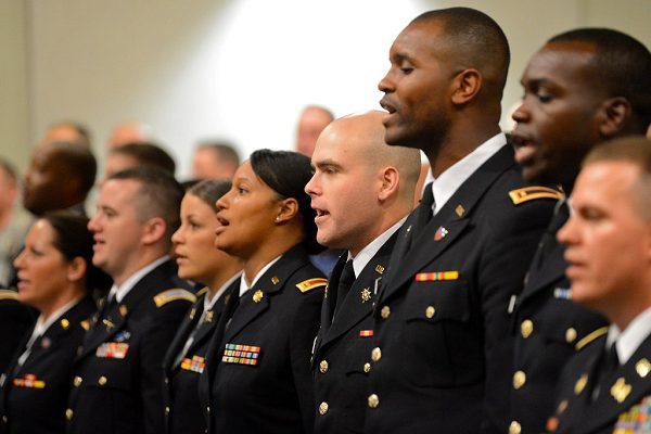 Newly commissioned second lieutenants sing the Army song at the conclusion of the graduation ceremony