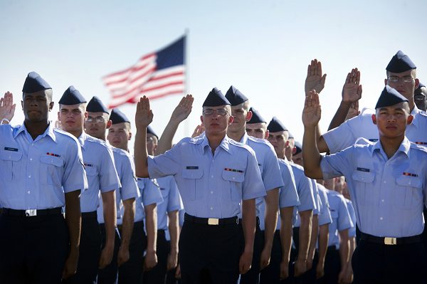 Airmen repeat the oath of enlistment at the basic training graduation ceremony