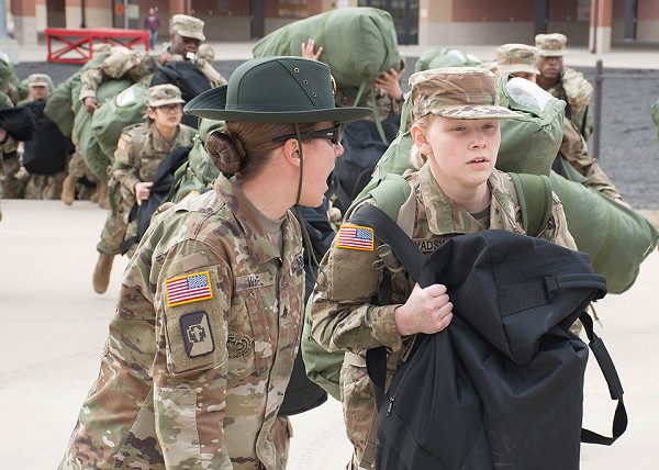 https://www.operationmilitarykids.org/wp-content/uploads/2020/08/Army-drill-sergeant-corrects-a-recruit-during-her-first-day-of-training-.jpg