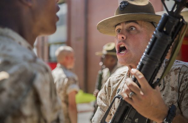 Drill Instructor inspects and disciplines recruits