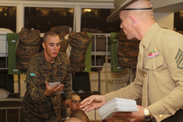 Marine Drill Instructor passes out boot camp letters during mail call