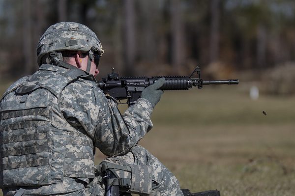 Soldier fires his M4 rifle during Army rifle qualification
