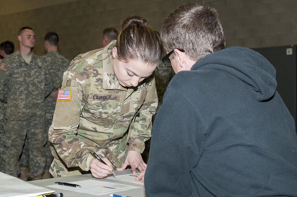 U.S. Army Pvt signs in at the beginning of drill at Training Site