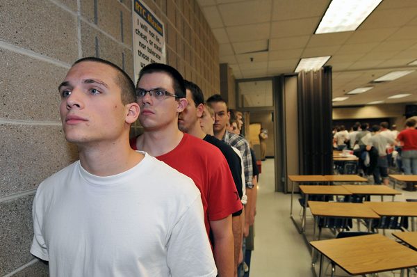 U.S. Navy recruits wait in line at Recruit Training Command