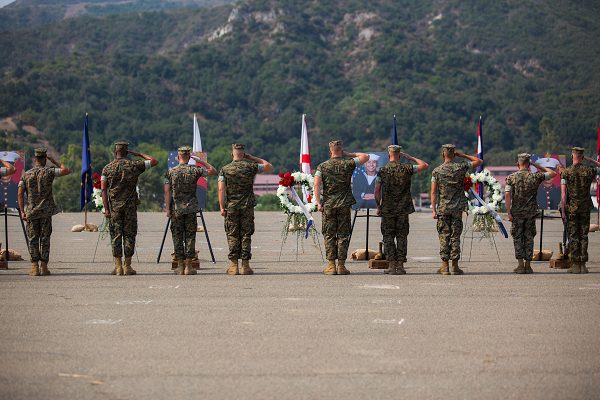 U.S. Marines render a salute during a memorial