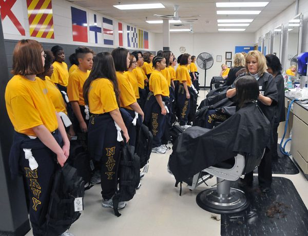navy boot camp recruits receive their first haircut