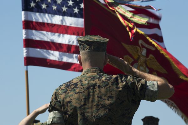 Marine salutes the flag according the the Marine General Orders