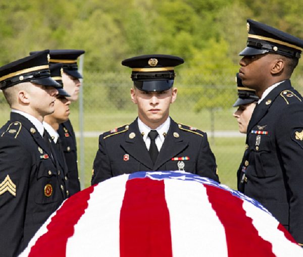 military color guard members rehearse the movements and commands of a full military funeral