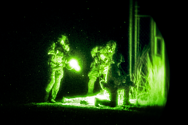 Army Special Forces members search a simulated casualty during a training exercise