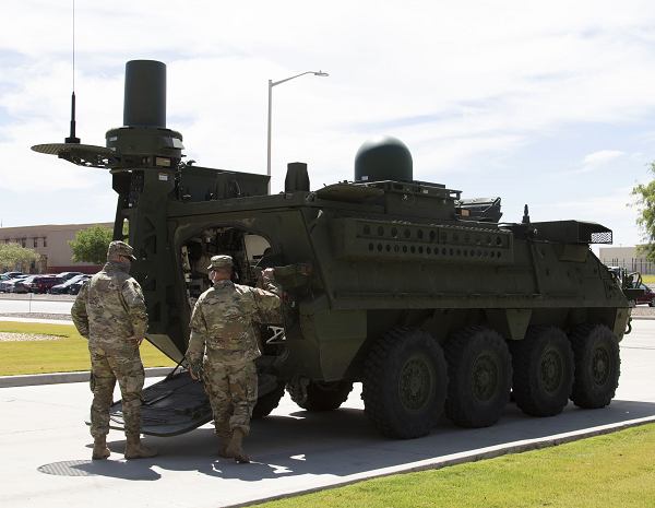 17 E MOS st Armored Division Electronic Warfare specialist take a look at the Army’s newest EW system, the Stryker-mounted Tactical Electronic Warfare System (TEWS)