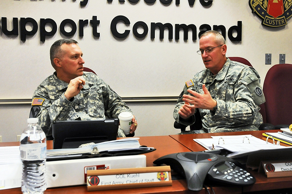 Col. Dale Kuehl, left, Chief of Staff, First Army, speaks with Army Reserve Col. Robert Rauchle, Deputy Commanding Officer, 85th Support Command, during a break at the First Army brigade executive officers brief