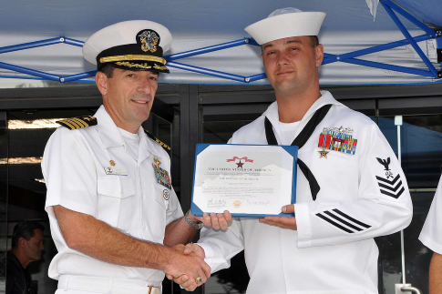 bronze star being awarded to us navy sailor