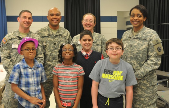 army pen pals pose for a photo