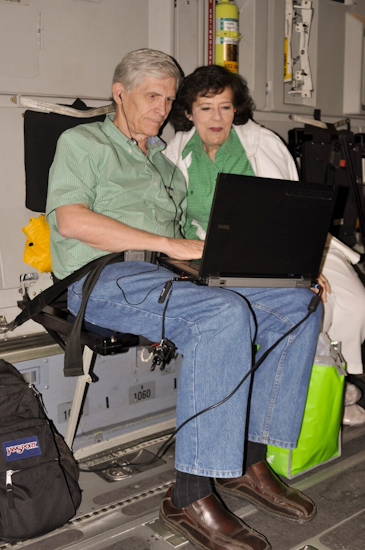 2 citizens looking at space a flights schedule